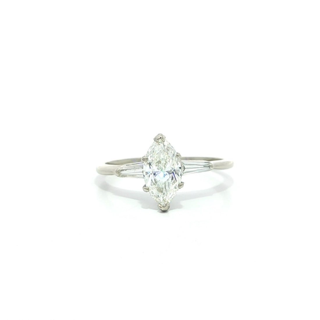 Vintage White Gold GIA Certified 1.12ct Diamond Engagement Ring: Vintage White Gold GIA Certified 1.12ct Diamond Engagement Ring This vintage engagement ring features a stunning marquise brilliant cut diamond at its center, certified by GIA with a total carat weigh