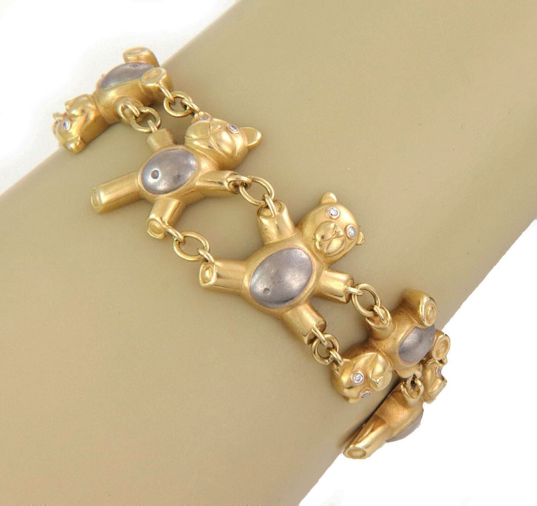 Vintage 18k Multi Tone Gold Link Bracelet with Teddy Bear Diamond Accents: Vintage 18k Multi Tone Gold Link Bracelet with Teddy Bear Diamond Accents This vintage link bracelet is crafted in 18k multi tone gold and features a distinctive teddy bear design accented with