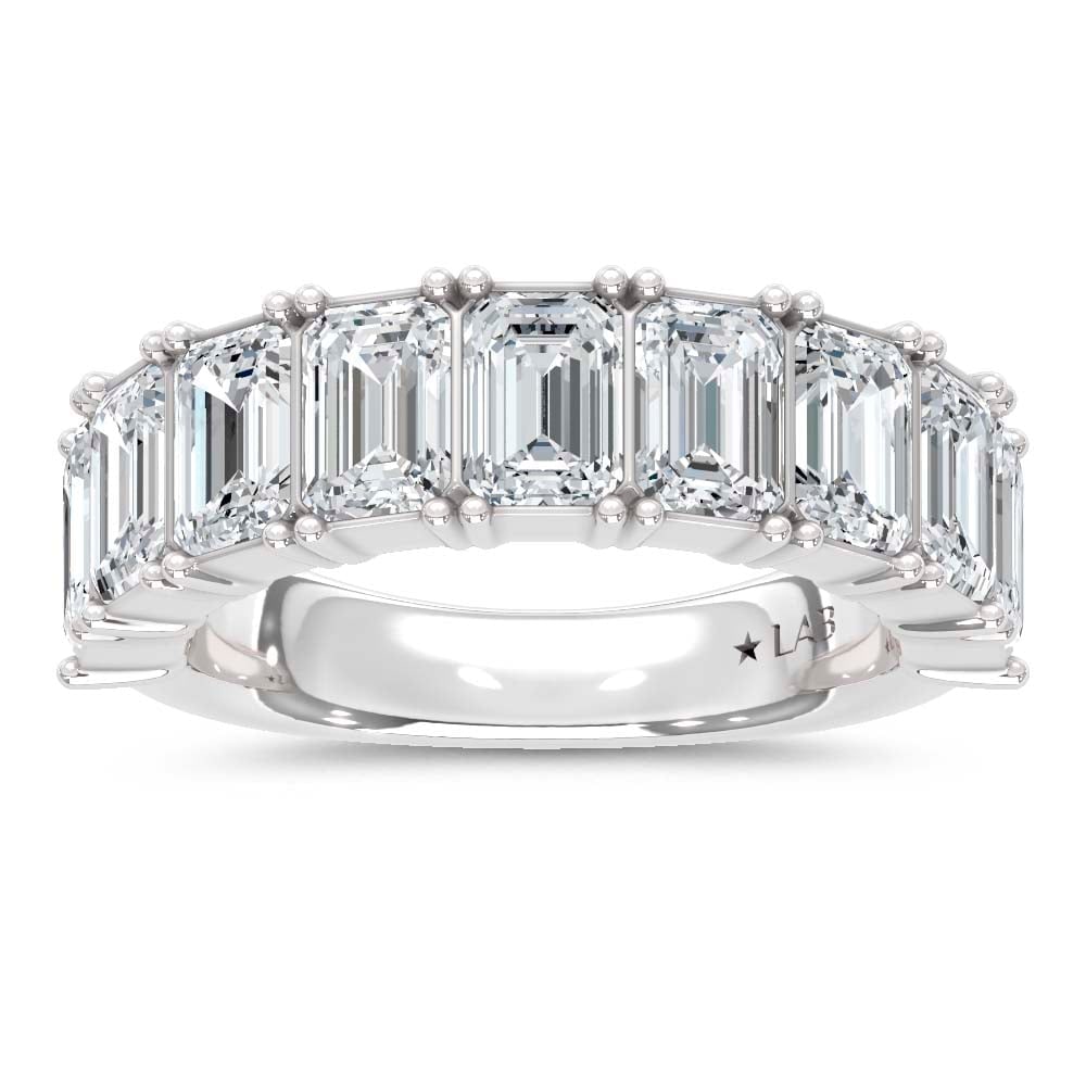 14K White Gold Lab Grown Diamond Emerald Cut Shape 5 Ct.Tw. Half Way Band: 14K White Gold Lab Grown Diamond Emerald Cut Shape 5 Ct.Tw. Half Way Band With 5 Ct.Tw. of stunning Emerald Cut Lab Grown Diamonds, this 14K White Gold Band offers unmatched luxury. The brilliance of