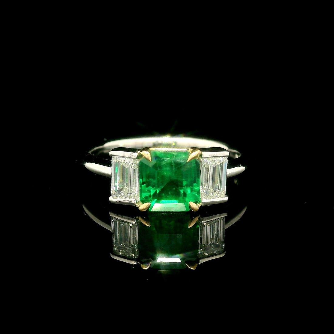 GIA Certified 1.68ct Emerald Diamond Classic Ring in Platinum and Gold: GIA Certified 1.68ct Emerald Diamond Classic Ring in Platinum and Gold This exquisite cocktail ring features a stunning natural emerald as its centerpiece, elegantly set in a solid .950+ platinum and