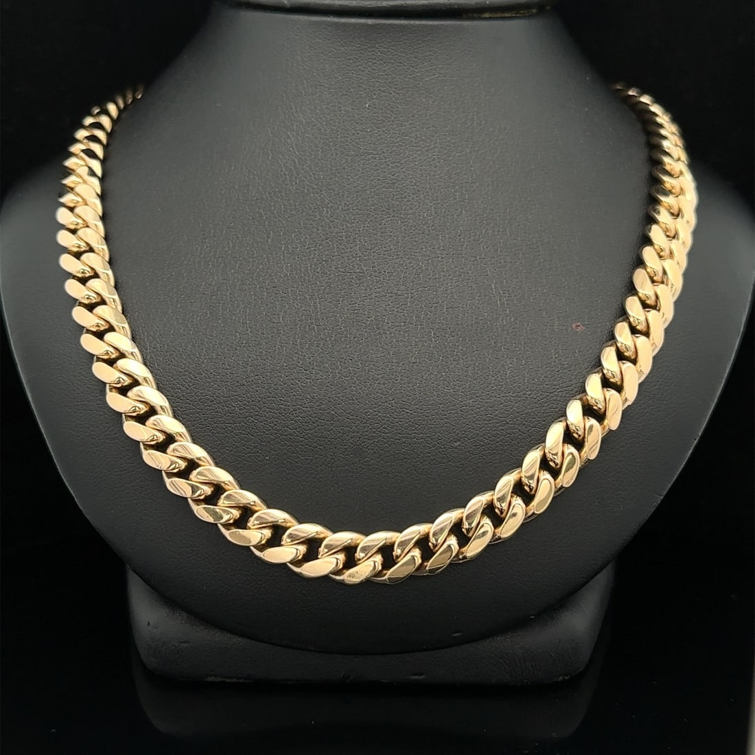 26 Inch 18k Yellow Gold Miami Cuban Link Chain Necklace 7.6mm Wide: 26 Inch 18k Yellow Gold Miami Cuban Link Chain Necklace 7.6mm Wide This vintage Miami Cuban curb link necklace is crafted from solid 17-18k yellow gold. Measuring 26 inches in length and 7.6mm wide, i