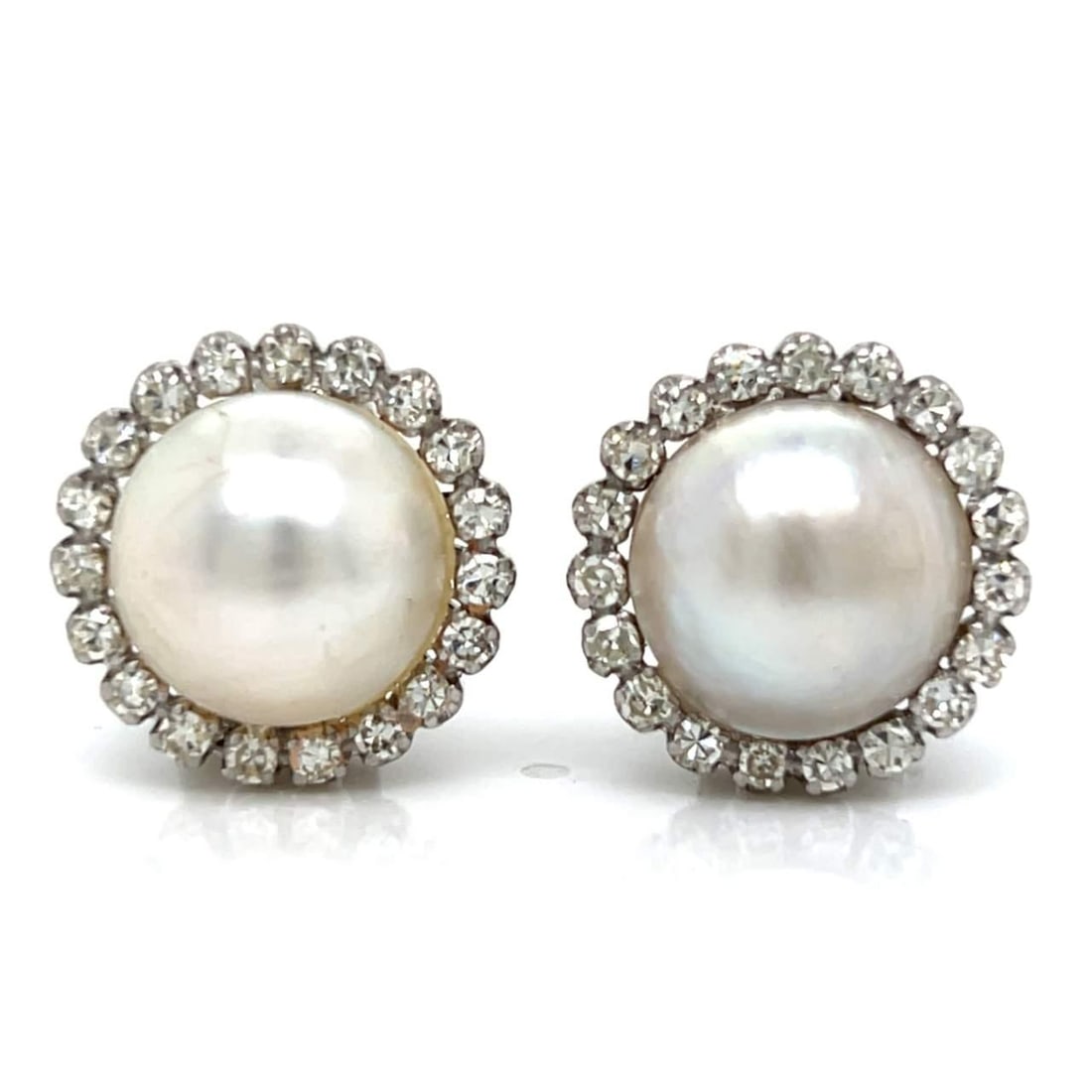 1950's Platinum Mabe Pearl Diamond Earrings 1.50 Ct 40 Diamonds: 1950's Platinum Mabe Pearl Diamond Earrings 1.50 Ct 40 Diamonds These exquisite 1950's Platinum Mabe Pearl & Diamond Earrings feature a stunning design that combines elegance with timeless appeal. Cra