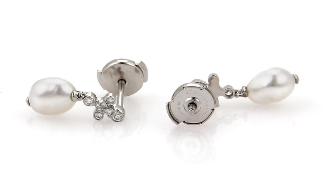 Platinum Dangle Earrings with Diamonds and Keshi Pearls by Tiffany & Co. Fleur: Platinum Dangle Earrings with Diamonds and Keshi Pearls by Tiffany & Co. Fleur These Tiffany & Co. Fleur Diamond Keshi Pearls Platinum Dangle Earrings feature a refined dangle/drop style. Each earring