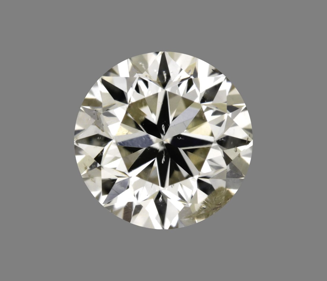 Loose Diamond - ROUND 0.31ct O-P I1: Loose Diamond - ROUND 0.31ct O-P I1 Source: Natural Shape: ROUND Carats: 0.31 Color: O-P Certification: GIA The Diamond Depot Guarantee: All items in this auction are guaranteed to be 100% authentic.
