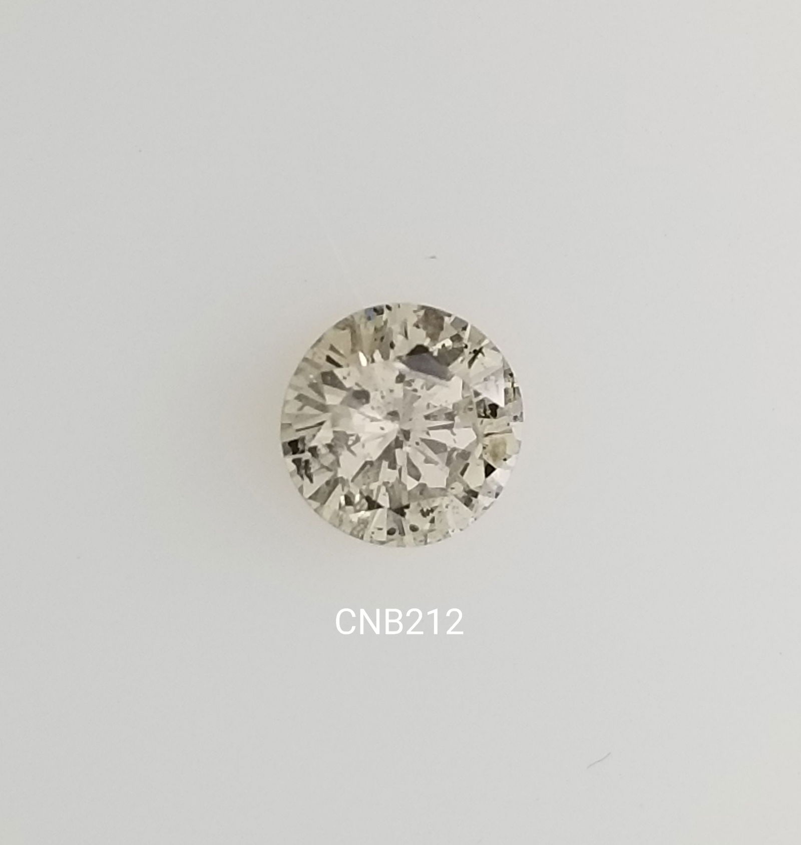 Loose Diamond - ROUND 0.86ct Light Champagne I2: Loose Diamond - ROUND 0.86ct Light Champagne I2 Source: Natural Shape: ROUND Carats: 0.86 Color: Light Champagne Certification: NONE The Diamond Depot Guarantee: All items in this auction are guarante