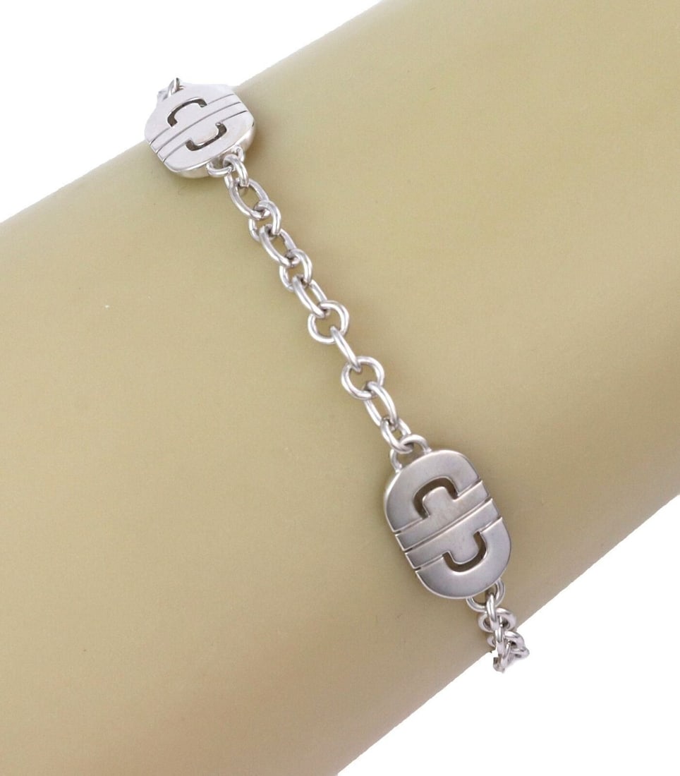 Parentesi Chain Bracelet with Three Charms in 18k White Gold by Bvlgari: Parentesi Chain Bracelet with Three Charms in 18k White Gold by Bvlgari This Bvlgari Parentesi bracelet is crafted from 18k white gold and features a chain link design adorned with three distinctive c