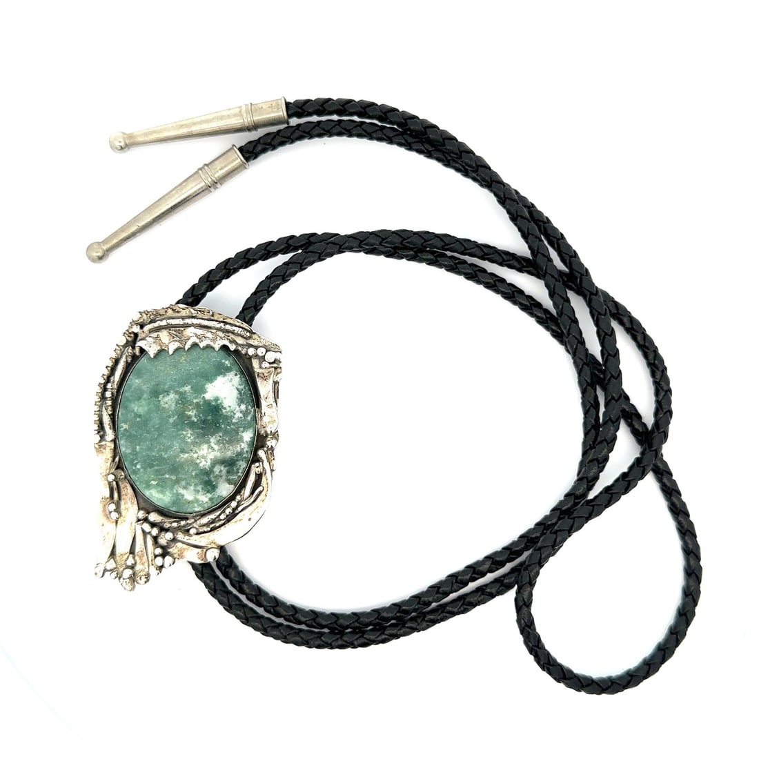 Sterling Silver Bolo Tie with Green Turquoise by Stan Davidson: Sterling Silver Bolo Tie with Green Turquoise by Stan Davidson This vintage bolo tie features a striking oval cabochon cut green turquoise stone with natural white variations, bezel set in sterling si