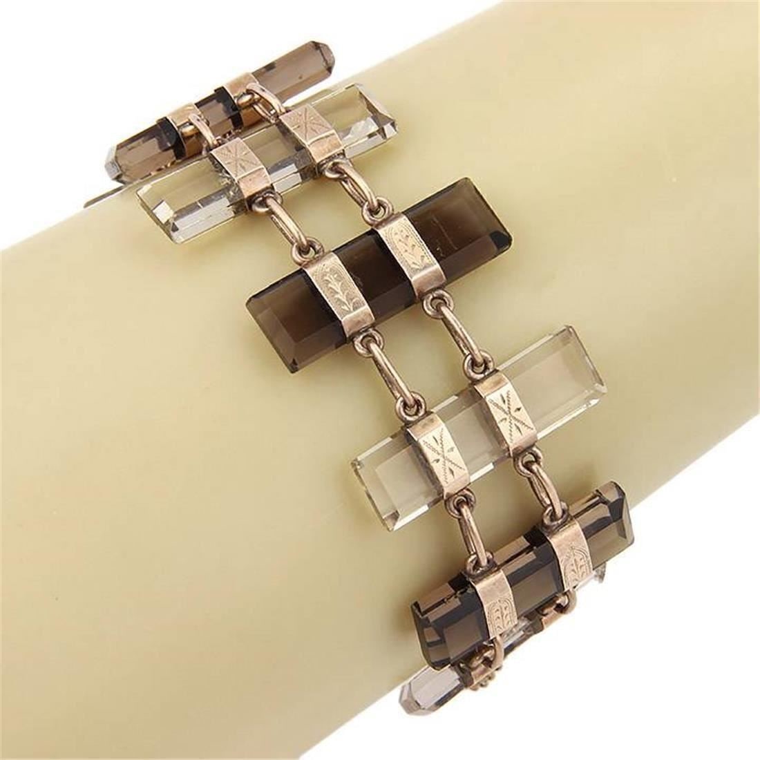 Antique 9k Rose and Yellow Gold Bar Link Bracelet With Smoky and Clear Quartz: Antique 9k Rose and Yellow Gold Bar Link Bracelet With Smoky and Clear Quartz This vintage bracelet showcases alternating smoky and clear quartz gemstones set in a stylish bar link design. Crafted fro