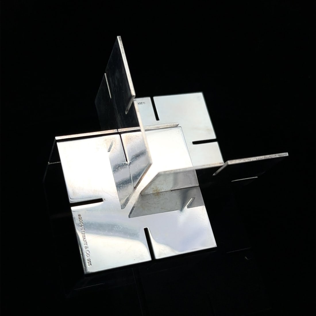 Tiffany & Co. Sterling Silver 8 Piece 3D Desk Puzzle with Pouch: Tiffany & Co. Sterling Silver 8 Piece 3D Desk Puzzle with Pouch This exquisite set features 8 pieces of a 3D desk puzzle crafted from high-quality sterling silver by Tiffany & Co. Each piece measures