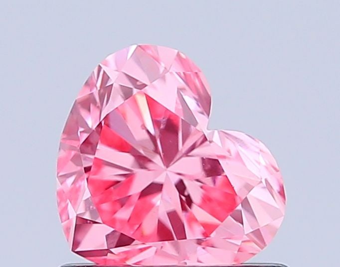 Loose Diamond - HEART 0.79ct Fancy Vivid Pink VS1: Loose Diamond - HEART 0.79ct Fancy Vivid Pink VS1 Source: This is a real non-mined Diamond that has been grown in a lab Shape: HEART Carats: 0.79 Color: Fancy Vivid Pink Certification: IGI Video: