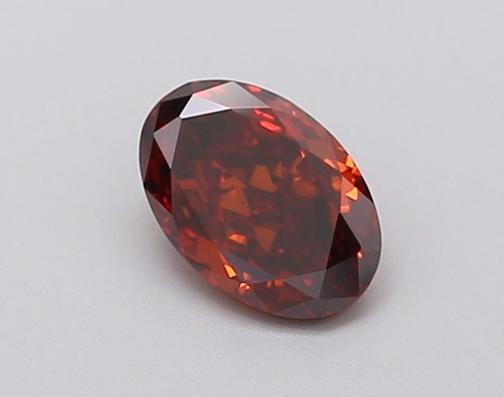 Loose Diamond - OVAL 0.63ct Fancy Deep Orange VS2: Loose Diamond - OVAL 0.63ct Fancy Deep Orange VS2 Source: This is a real non-mined Diamond that has been grown in a lab Shape: OVAL Carats: 0.63 Color: Fancy Deep Orange Certification: IGI Video: