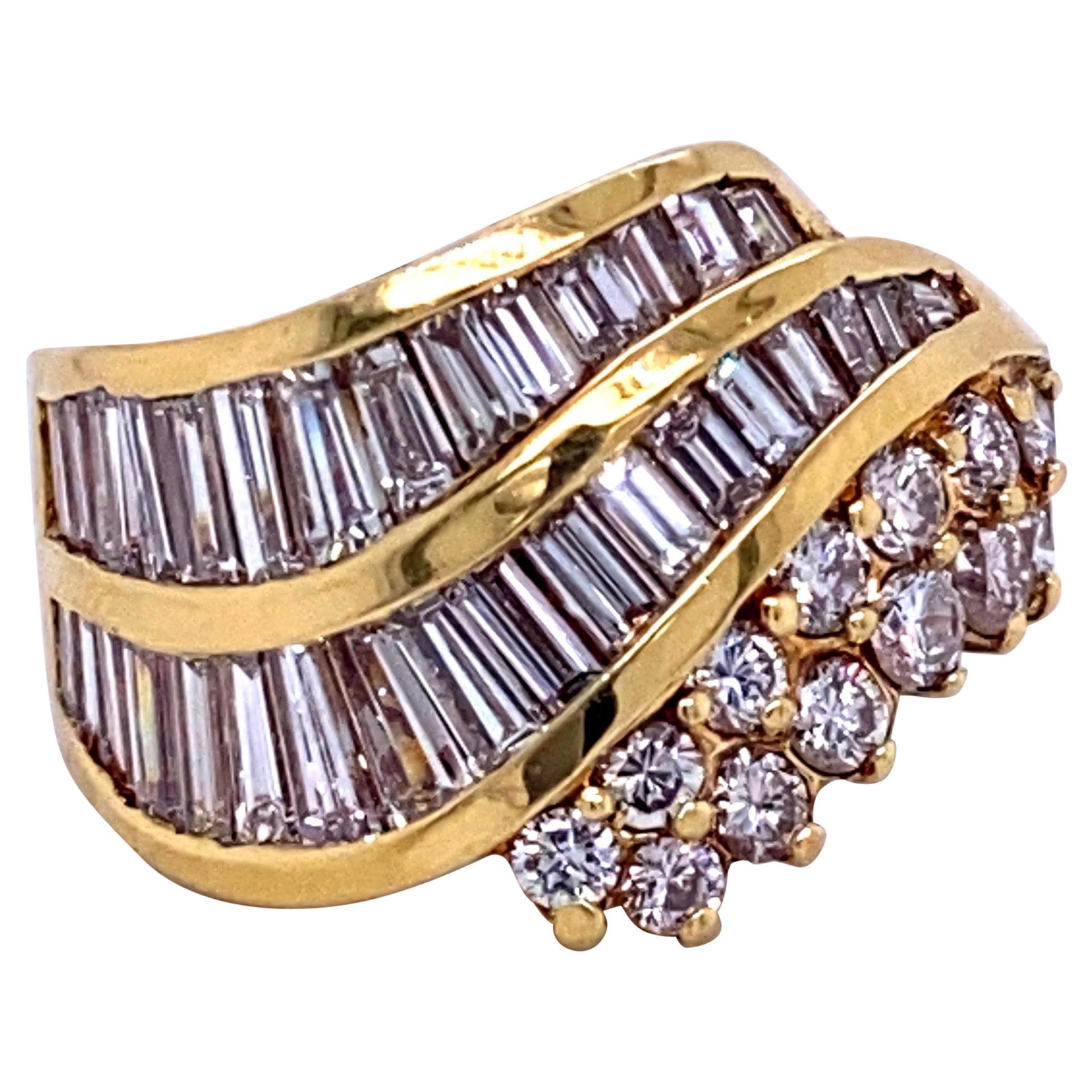 Harbor Diamonds 18K Yellow Gold Swirl Wave Ring 2.97ct Diamonds: Harbor Diamonds 18K Yellow Gold Swirl Wave Ring 2.97ct Diamonds This stunning contemporary ring showcases a swirl wave design, expertly crafted in 18k yellow gold. It features a total of 32 baguette-c