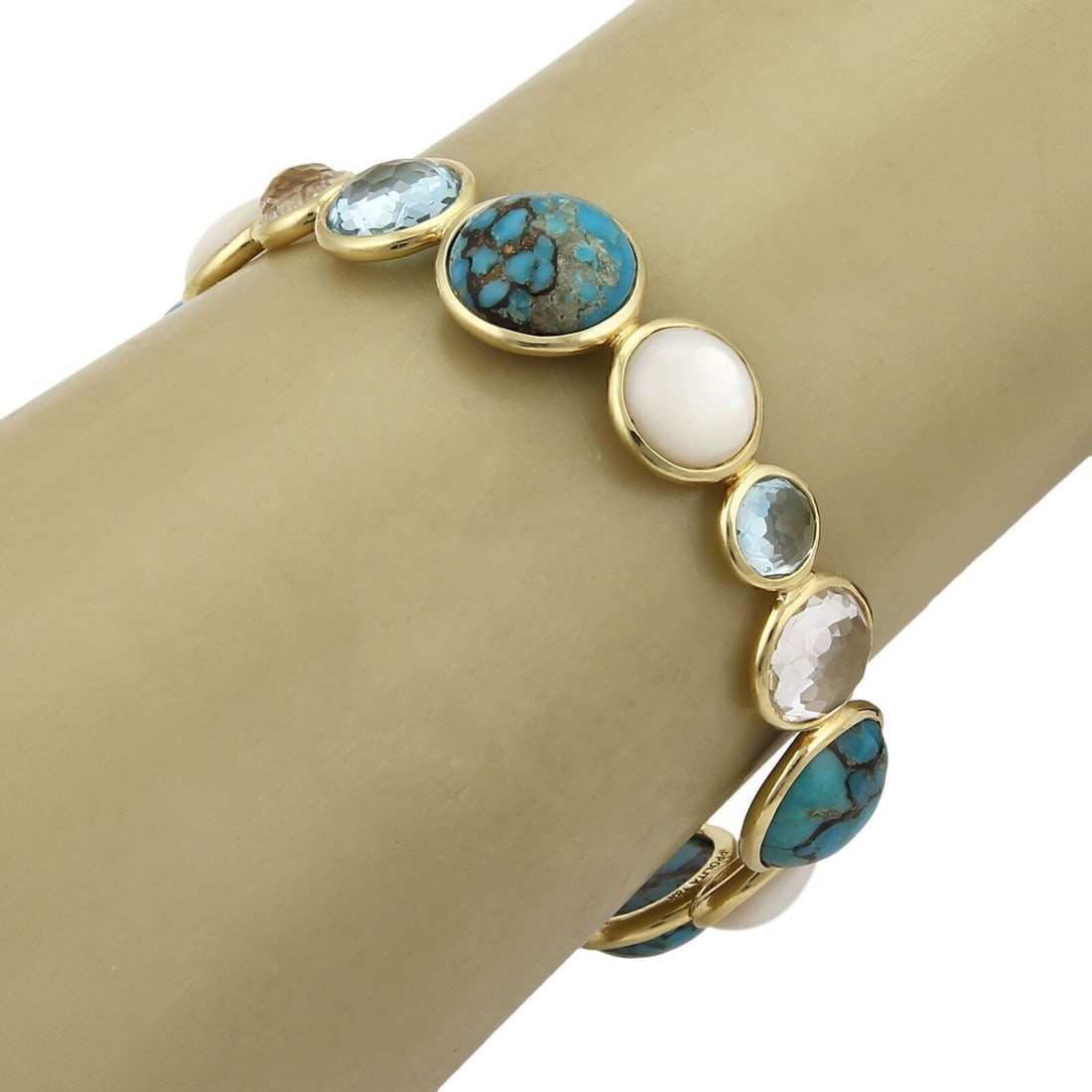 Ippolita Rock Candy 18k Gold Bangle Bracelet With Gemstones: Ippolita Rock Candy 18k Gold Bangle Bracelet With Gemstones This Ippolita Rock Candy Bangle Bracelet is crafted from 18k yellow gold and features a combination of turquoise, blue topaz, clear quartz,