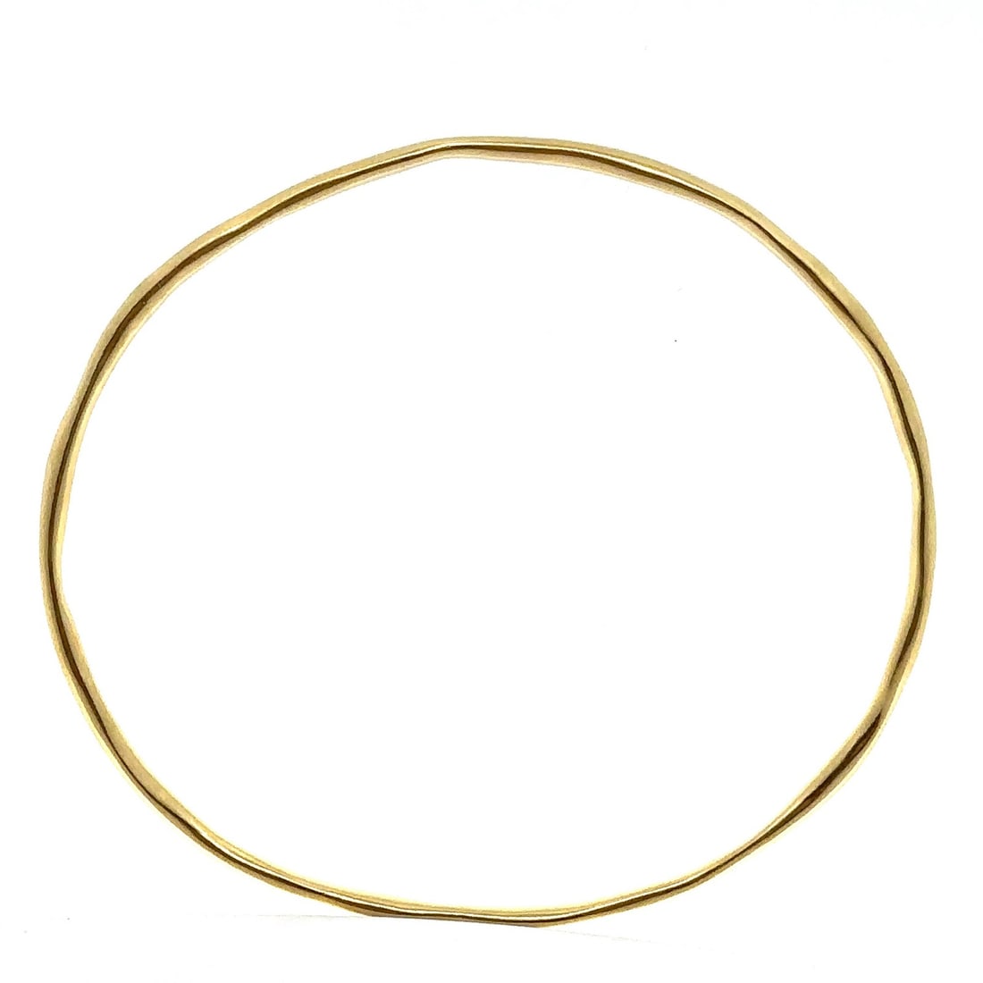 18k Yellow Gold Free Form Slip On Stackable Bangle Bracelet 7.25": 18k Yellow Gold Free Form Slip On Stackable Bangle Bracelet 7.25" This elegant bangle bracelet is crafted from solid 18k yellow gold, showcasing a unique free form wire design. It is a slip-on style t