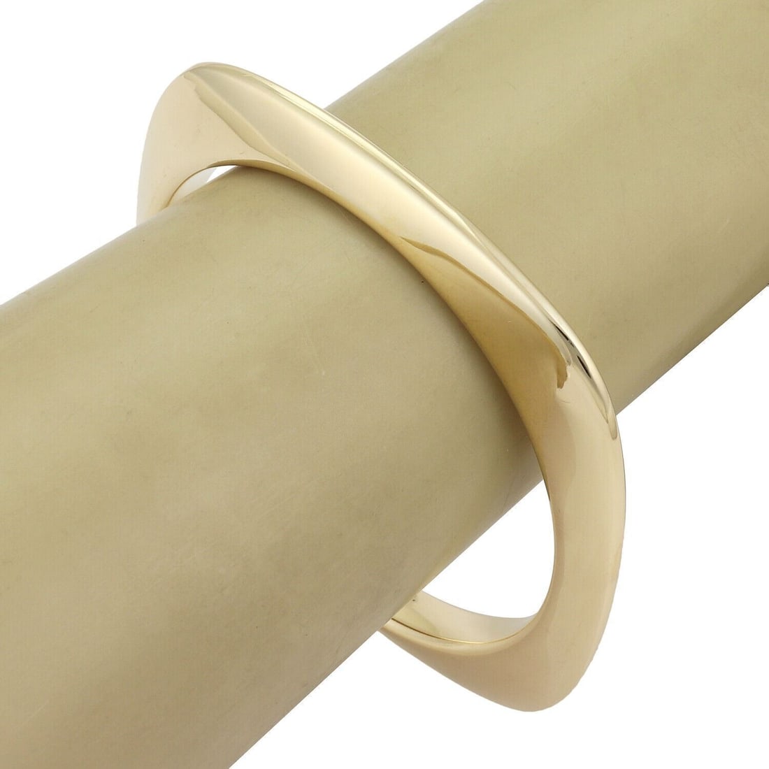 Cushion Shape 18k Yellow Gold Bangle Bracelet by Tiffany & Co.: Cushion Shape 18k Yellow Gold Bangle Bracelet by Tiffany & Co. This authentic Tiffany & Co. bangle bracelet is crafted from solid 18k yellow gold and features a cushion-shaped, softly contoured design