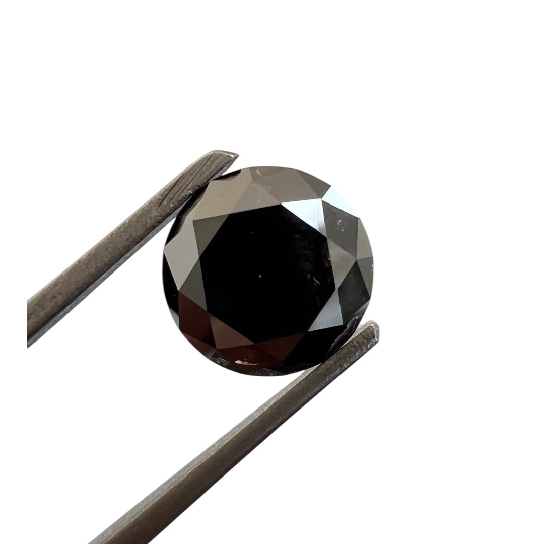 Loose Diamond - ROUND 1.76ct Fancy Black: Loose Diamond - ROUND 1.76ct Fancy Black Source: Natural Shape: ROUND Carats: 1.76 Color: Fancy Black Certification: GIA The Diamond Depot Guarantee: All items in this auction are guaranteed to be 100