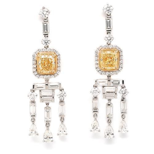 3.17 Ct Fancy Yellow Diamond Earrings 18k Yellow Gold Platinum: 3.17 Ct Fancy Yellow Diamond Earrings 18k Yellow Gold Platinum Elevate your elegance with these stunning earrings featuring a total of 3.17 carats of fancy yellow diamonds. Each earring showcases a ra