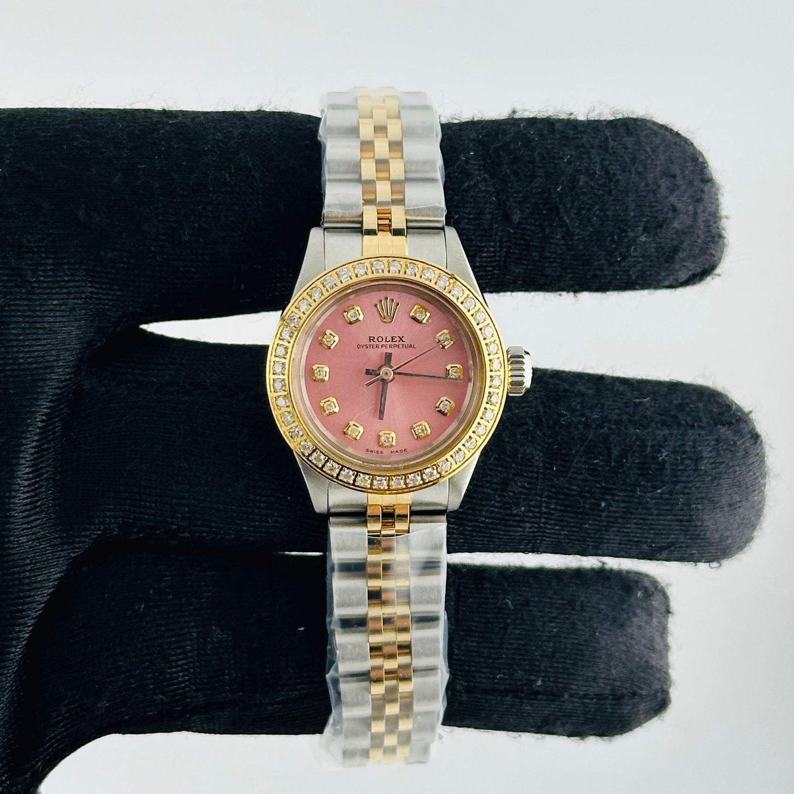 Rolex Oyster Perpetual Ref 6723 Ladies Watch With Aftermarket Pink Diamond Dial: Rolex Oyster Perpetual Ref 6723 Ladies Watch With Aftermarket Pink Diamond Dial This ladies' Rolex Oyster Perpetual features an aftermarket pink diamond dial and a pave plated diamond bezel. The watch