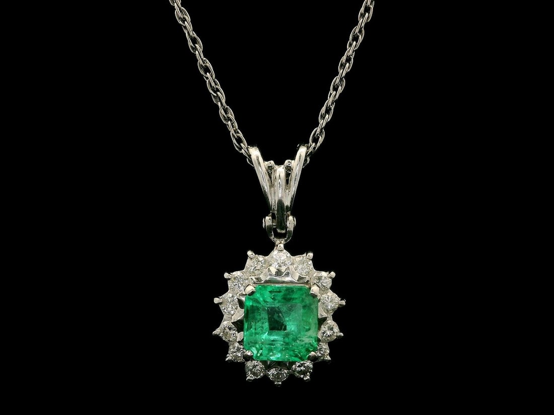 Vintage Platinum 1.69ct Colombian Emerald Diamond Halo Pendant Necklace 16in: Vintage Platinum 1.69ct Colombian Emerald Diamond Halo Pendant Necklace 16in This exquisite vintage pendant necklace features a stunning natural Colombian emerald, elegantly set in solid platinum. The
