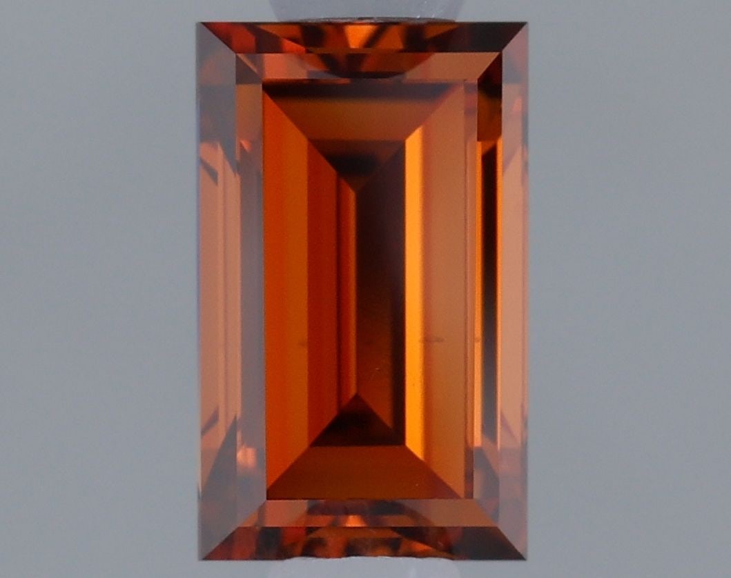 Loose Diamond - BAGUETTE 0.64ct Fancy Vivid Orange VS2: Loose Diamond - BAGUETTE 0.64ct Fancy Vivid Orange VS2 Source: This is a real non-mined Diamond that has been grown in a lab Shape: BAGUETTE Carats: 0.64 Color: Fancy Vivid Orange Certification: IGI V