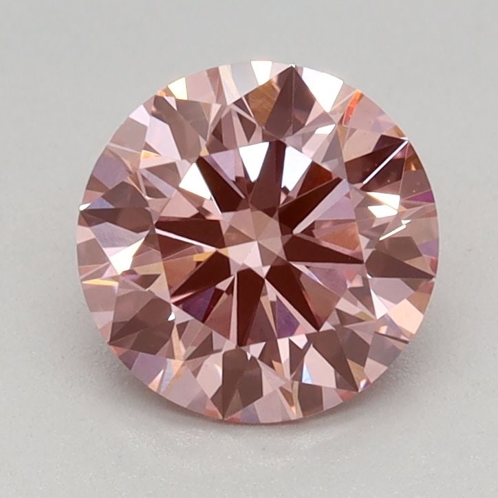 Ideal Loose Diamond - ROUND 0.91ct Fancy Vivid Pink VVS2: Ideal Loose Diamond - ROUND 0.91ct Fancy Vivid Pink VVS2 Source: This is a real non-mined Diamond that has been grown in a lab Shape: ROUND Carats: 0.91 Color: Fancy Vivid Pink Certification: IGI