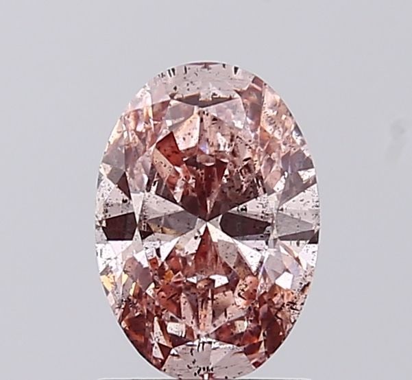 Loose Diamond - OVAL 1.0ct Fancy Vivid Brownish Pink I2: Loose Diamond - OVAL 1.0ct Fancy Vivid Brownish Pink I2 Source: This is a real non-mined Diamond that has been grown in a lab Shape: OVAL Carats: 1.0 Color: Fancy Vivid Brownish Pink Certification: IG