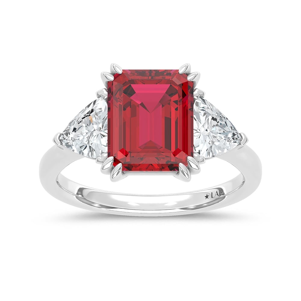 14K White Gold Lab Grown Diamond 5 7/8 Ct.Tw. Emerald Shape Recrystalized Ruby Engagement Ring: 14K White Gold Lab Grown Diamond 5 7/8 Ct.Tw. Emerald Shape Recrystalized Ruby Engagement Ring (Center 4 1/2 ct) Exude refined sophistication with this 14K white gold engagement ring, featuring a stri