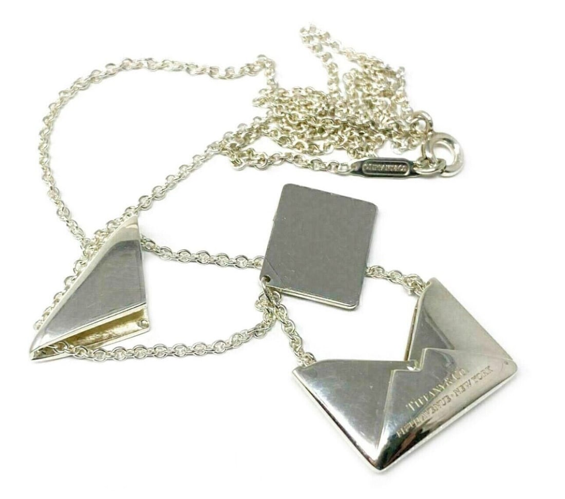 Sweet Nothing Envelope Pendant Necklace in Sterling Silver by Tiffany & Co.: Sweet Nothing Envelope Pendant Necklace in Sterling Silver by Tiffany & Co. This Tiffany & Co. Sweet Nothing necklace features a sterling silver envelope pendant with movable letter accents, offering