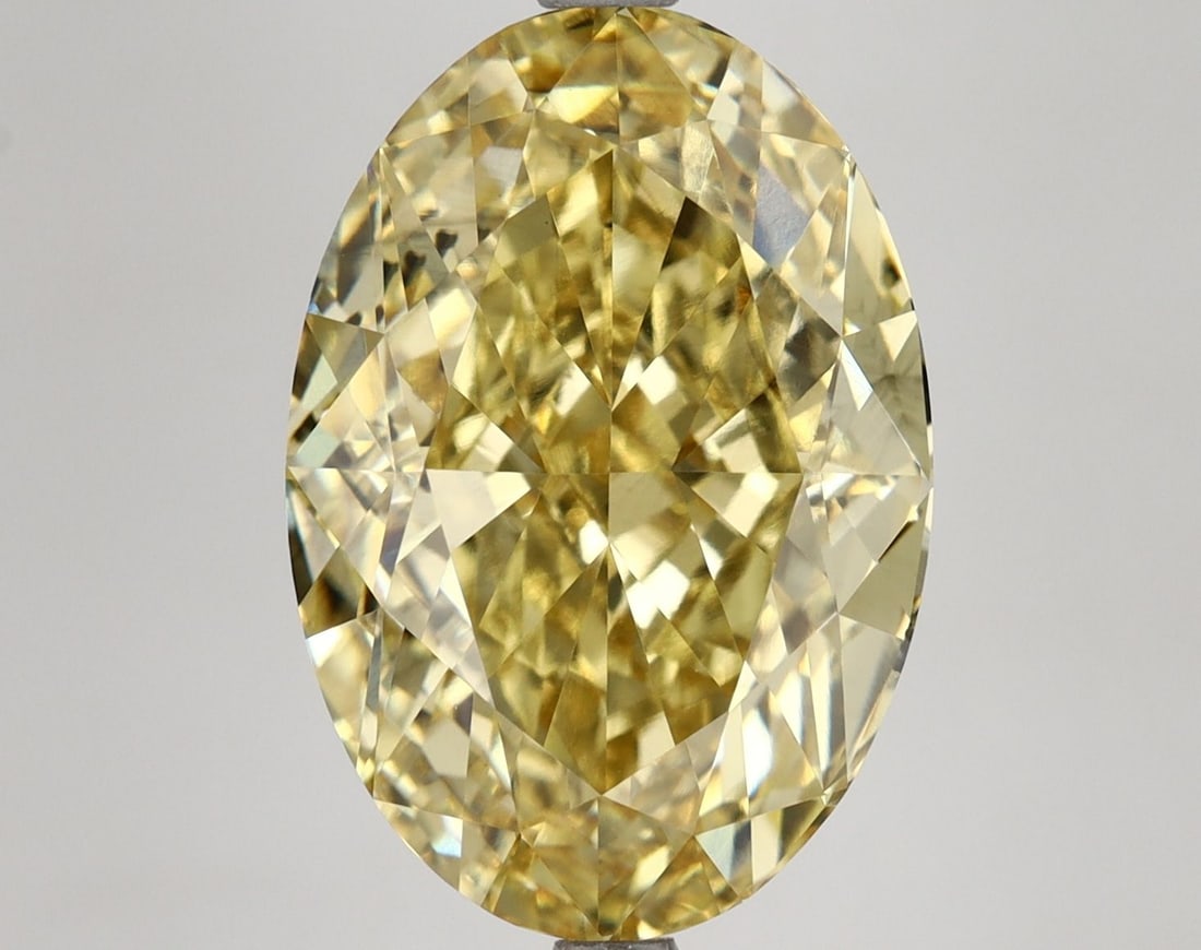 Loose Diamond - OVAL 9.77ct Fancy Vivid Yellow VS1: Loose Diamond - OVAL 9.77ct Fancy Vivid Yellow VS1 Source: This is a real non-mined Diamond that has been grown in a lab Shape: OVAL Carats: 9.77 Color: Fancy Vivid Yellow Certification: IGI Video: