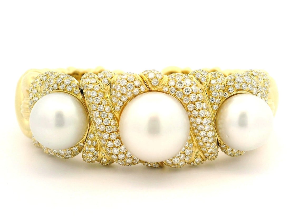 RCM 18k Gold Diamond 5.4ctw & 3 South Sea Pearls Cuff Bracelet: RCM 18k Gold Diamond 5.4ctw & 3 South Sea Pearls Cuff Bracelet This exquisite flexible cuff bracelet features a stunning combination of natural diamonds and South Sea pearls. Crafted from solid 18k ye