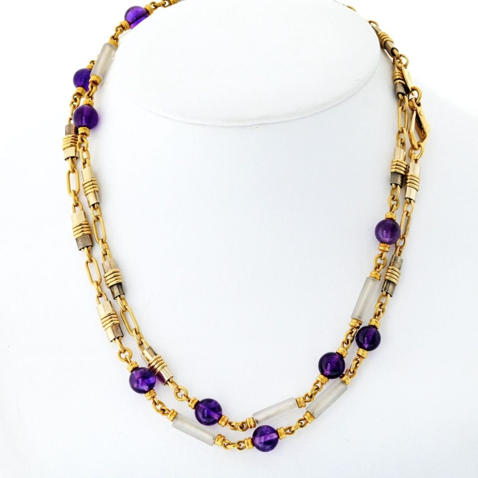 Bvlgari 18K Yellow Gold Amethyst Crystal Link Necklace 34.5in: Bvlgari 18K Yellow Gold Amethyst Crystal Link Necklace 34.5in This exquisite vintage Bvlgari chain necklace is a true statement piece crafted from luxurious 18K yellow gold. It features a stunning com