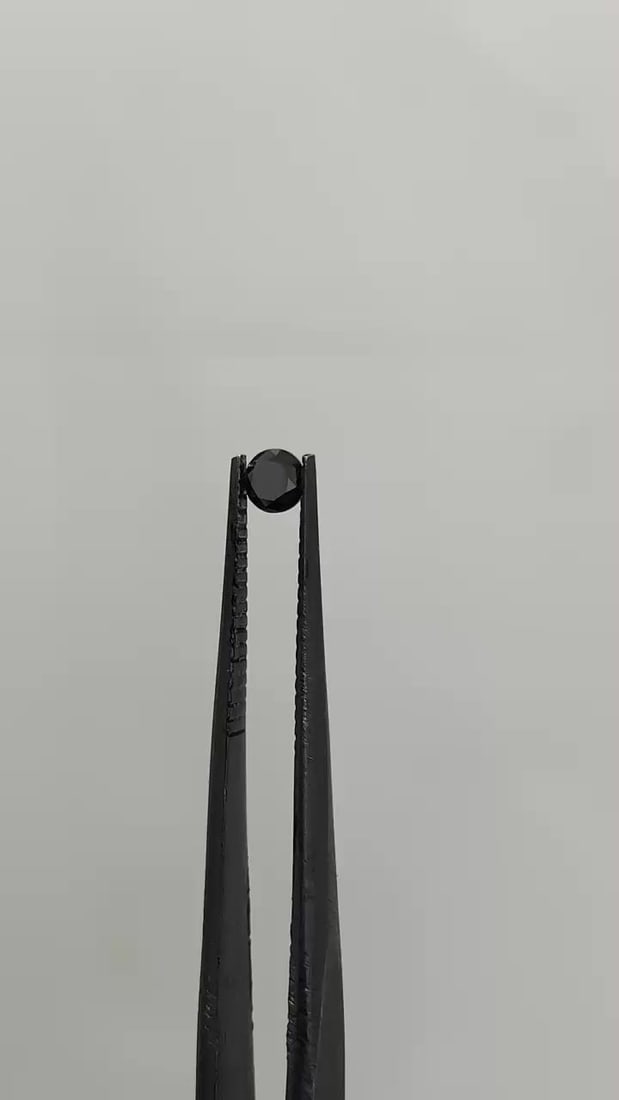 Loose Diamond - ROUND 0.2ct Black: Loose Diamond - ROUND 0.2ct Black Source: Natural Shape: ROUND Carats: 0.2 Color: Black Certification: IGI Video: Video Link The Diamond Depot Guarantee: All items in this auction are guaranteed