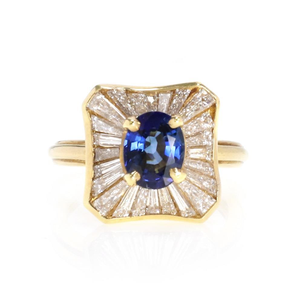 18k Yellow Gold 2.70ct Diamond Sapphire Ballerina Cocktail Ring: 18k Yellow Gold 2.70ct Diamond Sapphire Ballerina Cocktail Ring This stunning ballerina ring showcases a captivating design in 18k yellow gold. At the center, an exquisite oval sapphire gemstone is el