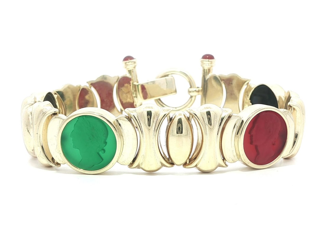 14k Yellow Gold Bracelet With Round Cameo Portrait and Colored Cabochon Stones: 14k Yellow Gold Bracelet With Round Cameo Portrait and Colored Cabochon Stones This pre-owned bracelet features solid 14k yellow gold with a substantial weight and elegant design. It is adorned with f