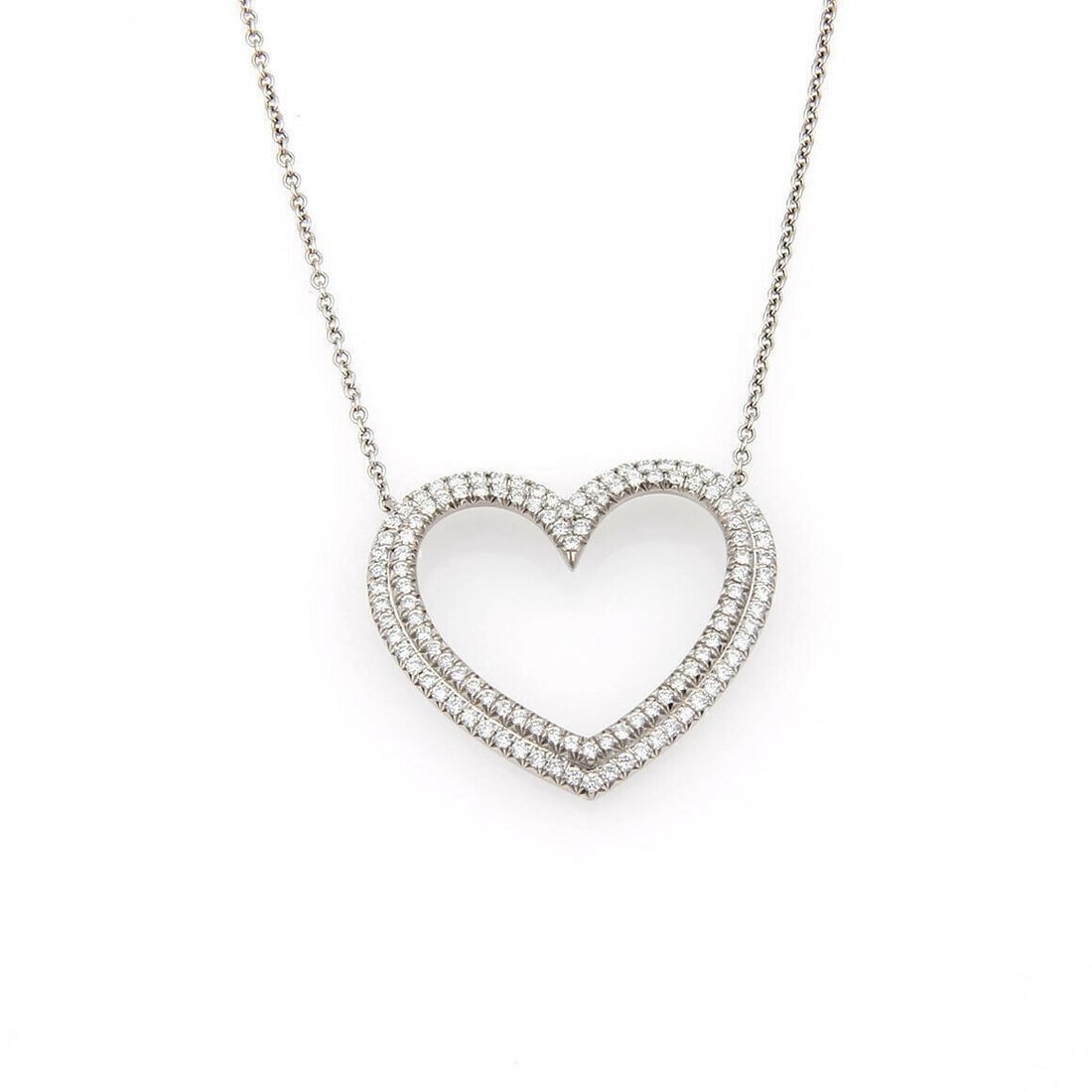 Large Platinum Heart Pendant Necklace with Diamonds by Tiffany & Co. Metro: Large Platinum Heart Pendant Necklace with Diamonds by Tiffany & Co. Metro This Tiffany & Co. Large Metro Diamond Platinum Heart Pendant Necklace features a platinum heart-shaped pendant set with diam