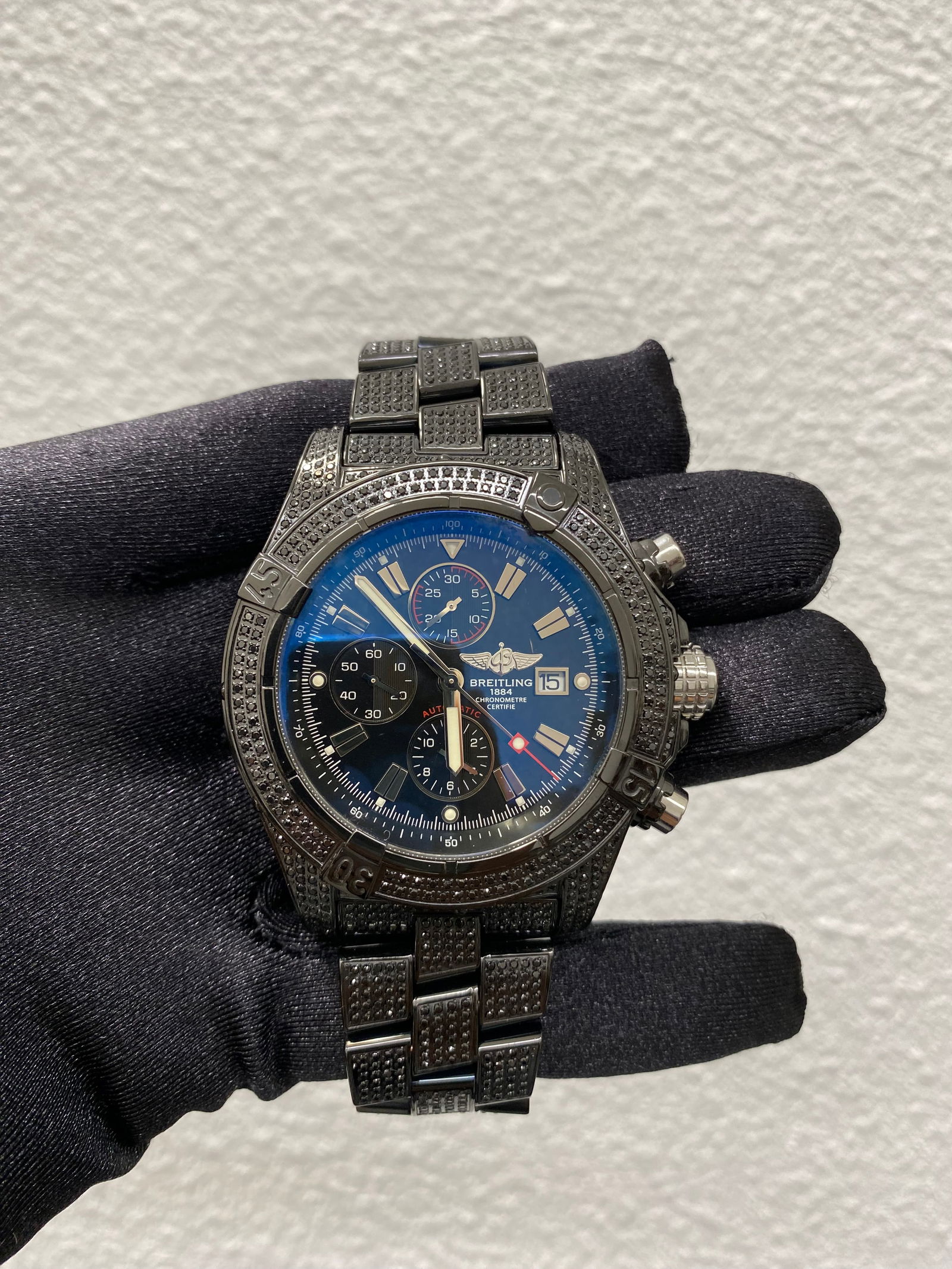 Super Avenger Men's Watch A13370 Black Dial Diamond Bezel Black Plated Bracelet: Super Avenger Men's Watch A13370 Black Dial Diamond Bezel Black Plated Bracelet This Breitling Super Avenger features a striking black dial and a diamond-set bezel. The black plated bracelet is also a