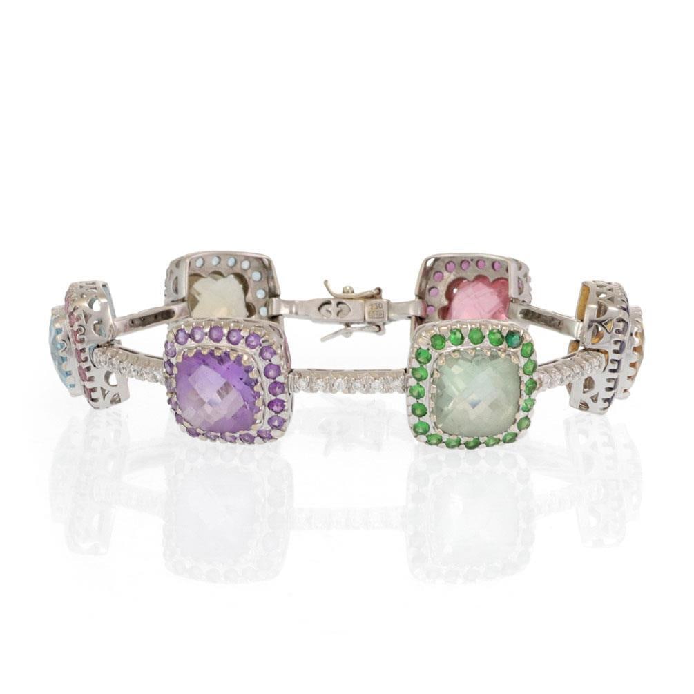 Stunning 18k White Gold Multicolor Gemstone Bracelet with 70 Points Diamonds: Stunning 18k White Gold Multicolor Gemstone Bracelet with 70 Points Diamonds Presenting a stunning multicolor gemstone bracelet, expertly crafted from 18k white gold. This exquisite piece features six