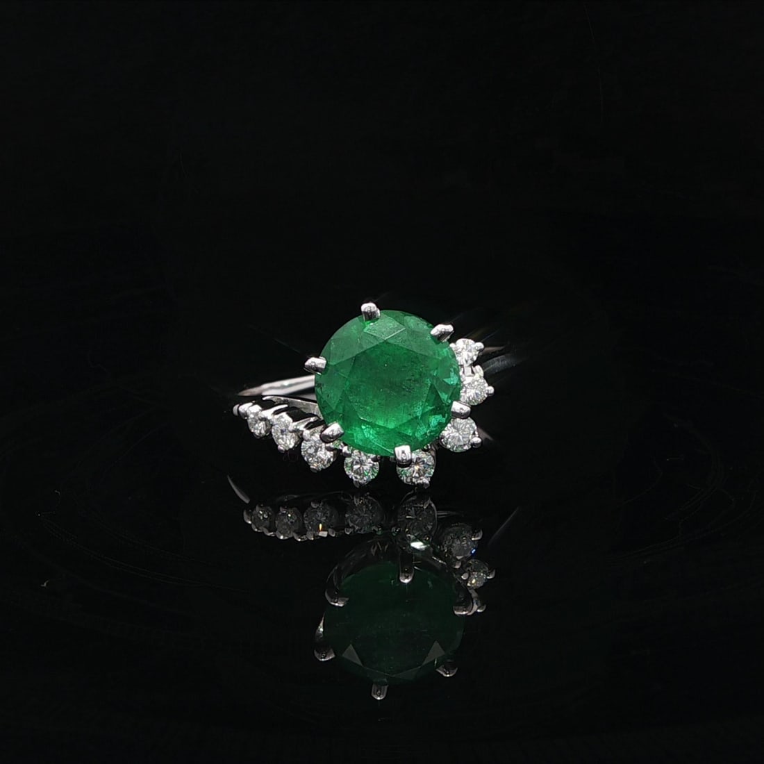 Vintage GIA Certified 2.67ct White Gold Emerald Diamond Swirl Ring: Vintage GIA Certified 2.67ct White Gold Emerald Diamond Swirl Ring This exquisite vintage ring showcases a stunning large round natural emerald, featuring a brilliant cut and set securely in a 6-prong