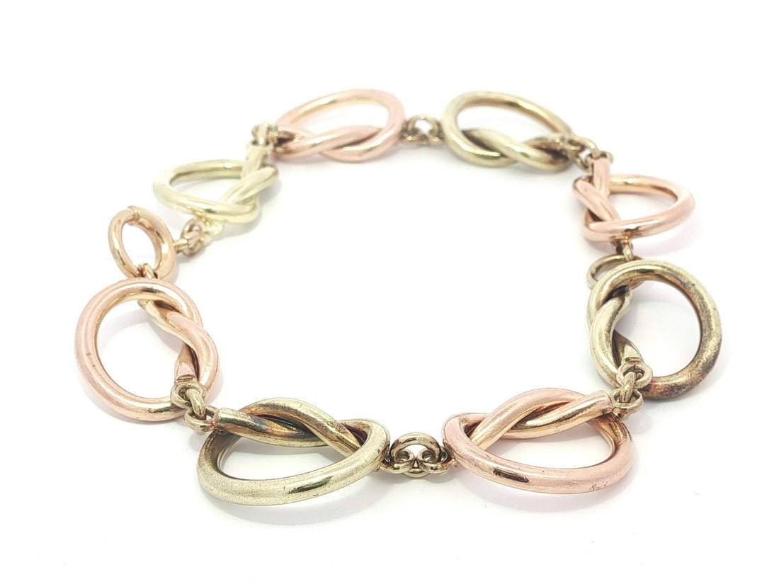 Vintage Tiffany & Co. 14k Rose Green Gold Open Knot Bracelet: Vintage Tiffany & Co. 14k Rose Green Gold Open Knot Bracelet This exquisite Vintage Retro Tiffany & Co. bracelet showcases a stunning design crafted from solid 14k rose and green gold. The open knot l