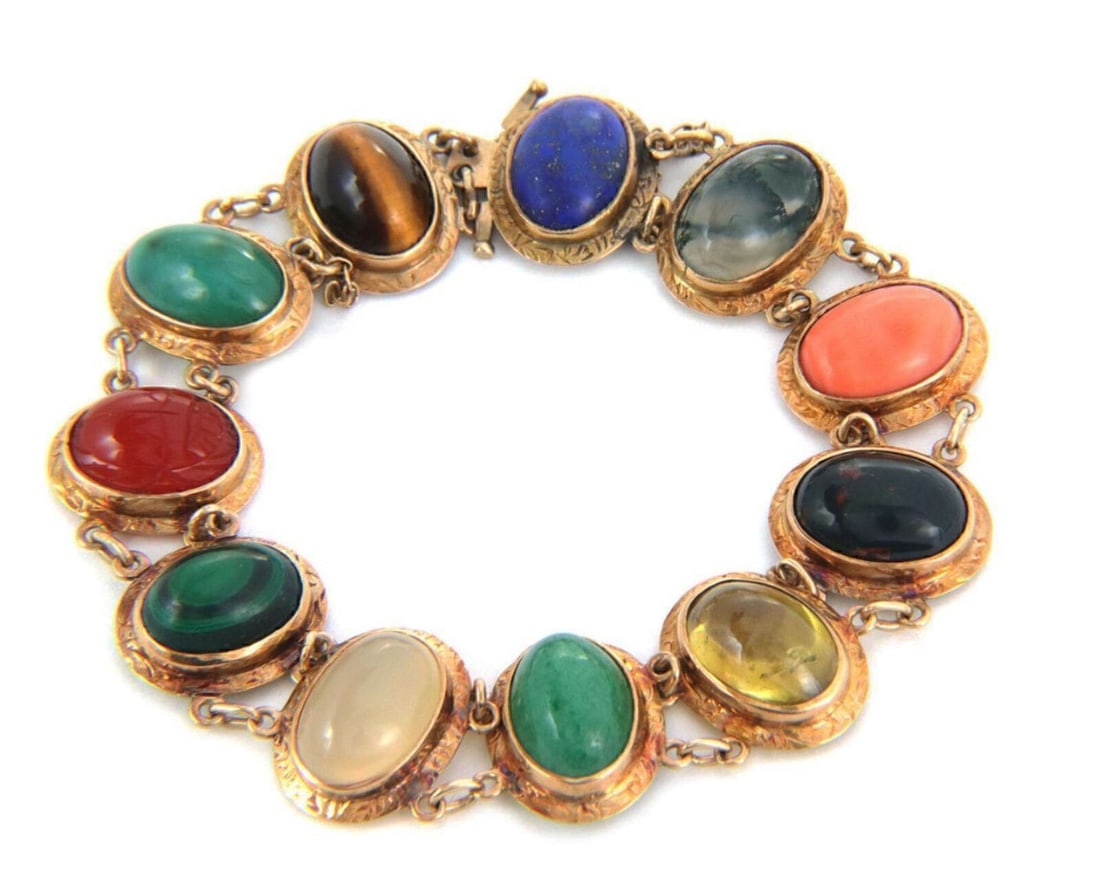 Vintage 14k Rose Gold Bracelet With Multicolor Cabochon Gemstones Oval Links: Vintage 14k Rose Gold Bracelet With Multicolor Cabochon Gemstones Oval Links This vintage link bracelet features cabochon multicolor gemstones including carnelian, malachite, moonstone, onyx, lapis, t
