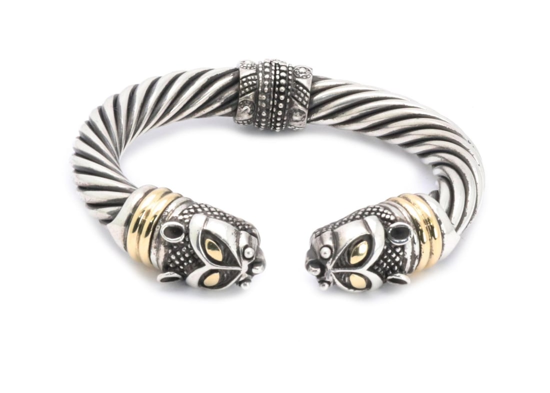 Designer Signed Sterling Silver 18k Gold Cat Head Cuff Bracelet: Designer Signed Sterling Silver 18k Gold Cat Head Cuff Bracelet This stunning designer signed cuff bracelet showcases a unique blend of sterling silver and 18k yellow gold accents. The bracelet featur