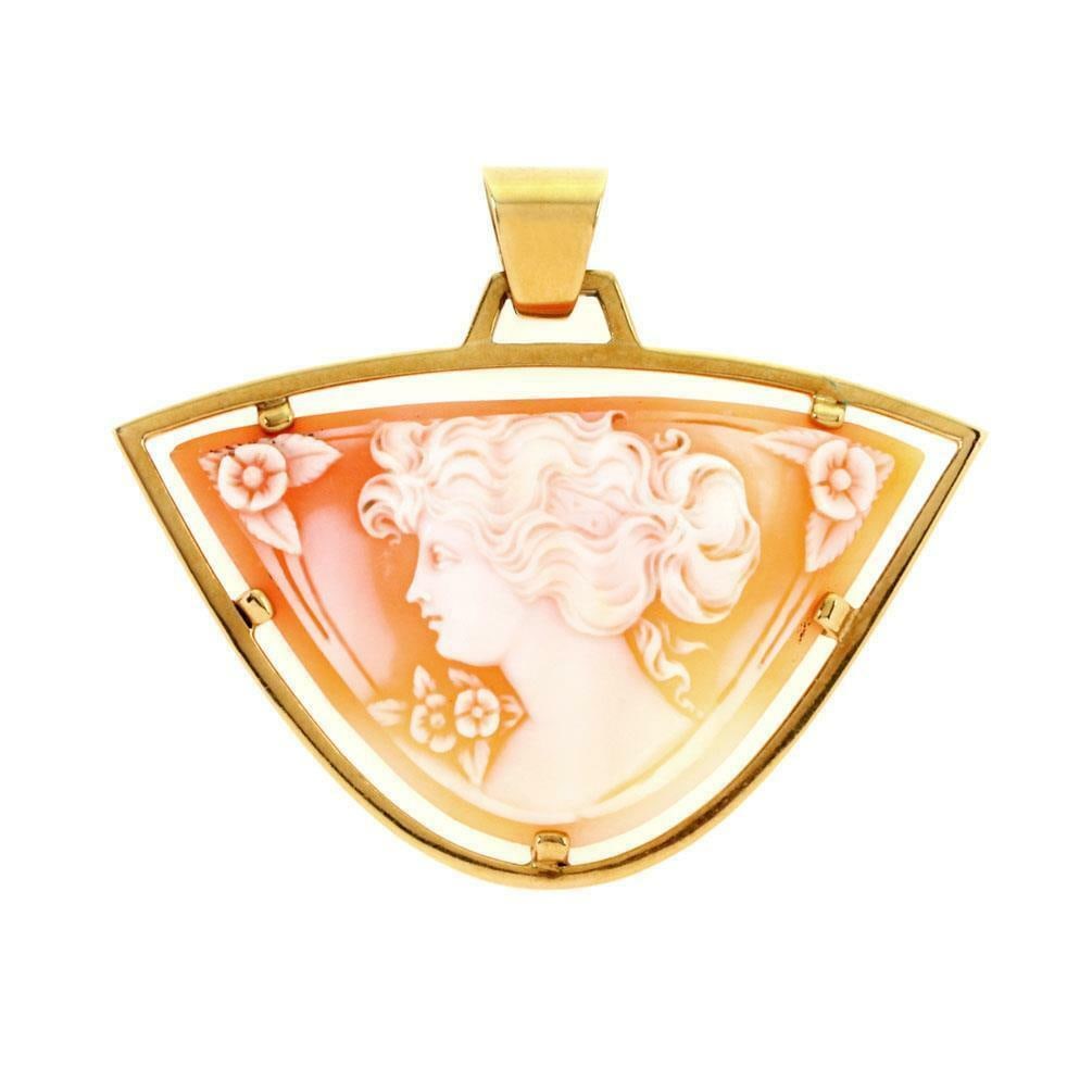 Cartier 18k Yellow Gold Triangular Shell Cameo Pendant: Cartier 18k Yellow Gold Triangular Shell Cameo Pendant This exquisite vintage pendant from Cartier is crafted from 18k yellow gold, showcasing a polished finish. The pendant features a unique triangul