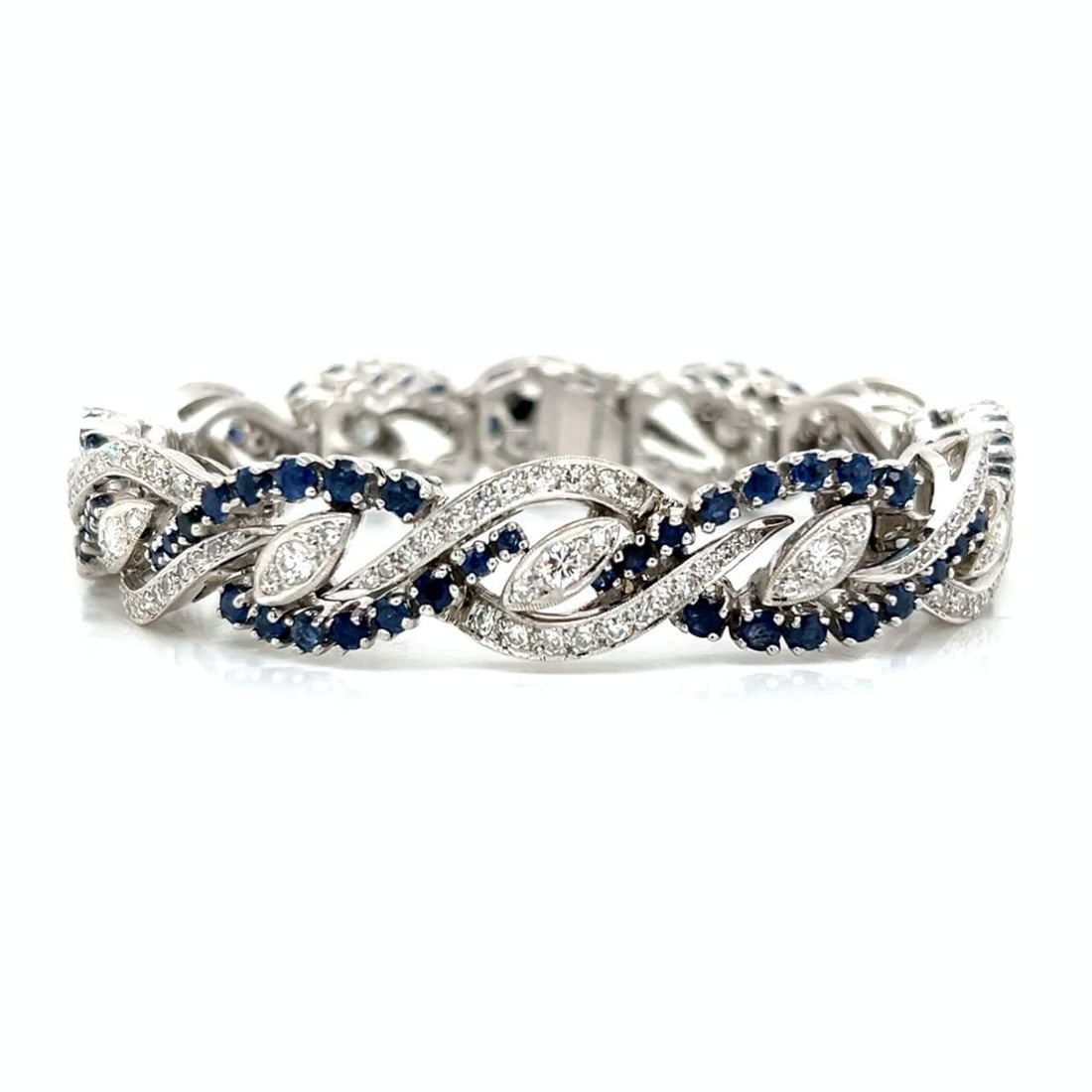1960s 14K White Gold Diamond Sapphire Bracelet 300 Diamonds 96 Sapphires: 1960s 14K White Gold Diamond Sapphire Bracelet 300 Diamonds 96 Sapphires This stunning bracelet from the 1960s features a luxurious design crafted in 14K white gold. Adorned with a remarkable total of