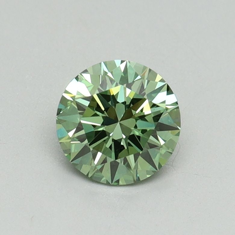 Loose Diamond - ROUND 0.65ct Fancy Vivid Green VS1: Loose Diamond - ROUND 0.65ct Fancy Vivid Green VS1 Source: This is a real non-mined Diamond that has been grown in a lab Shape: ROUND Carats: 0.65 Color: Fancy Vivid Green Certification: IGI Video: