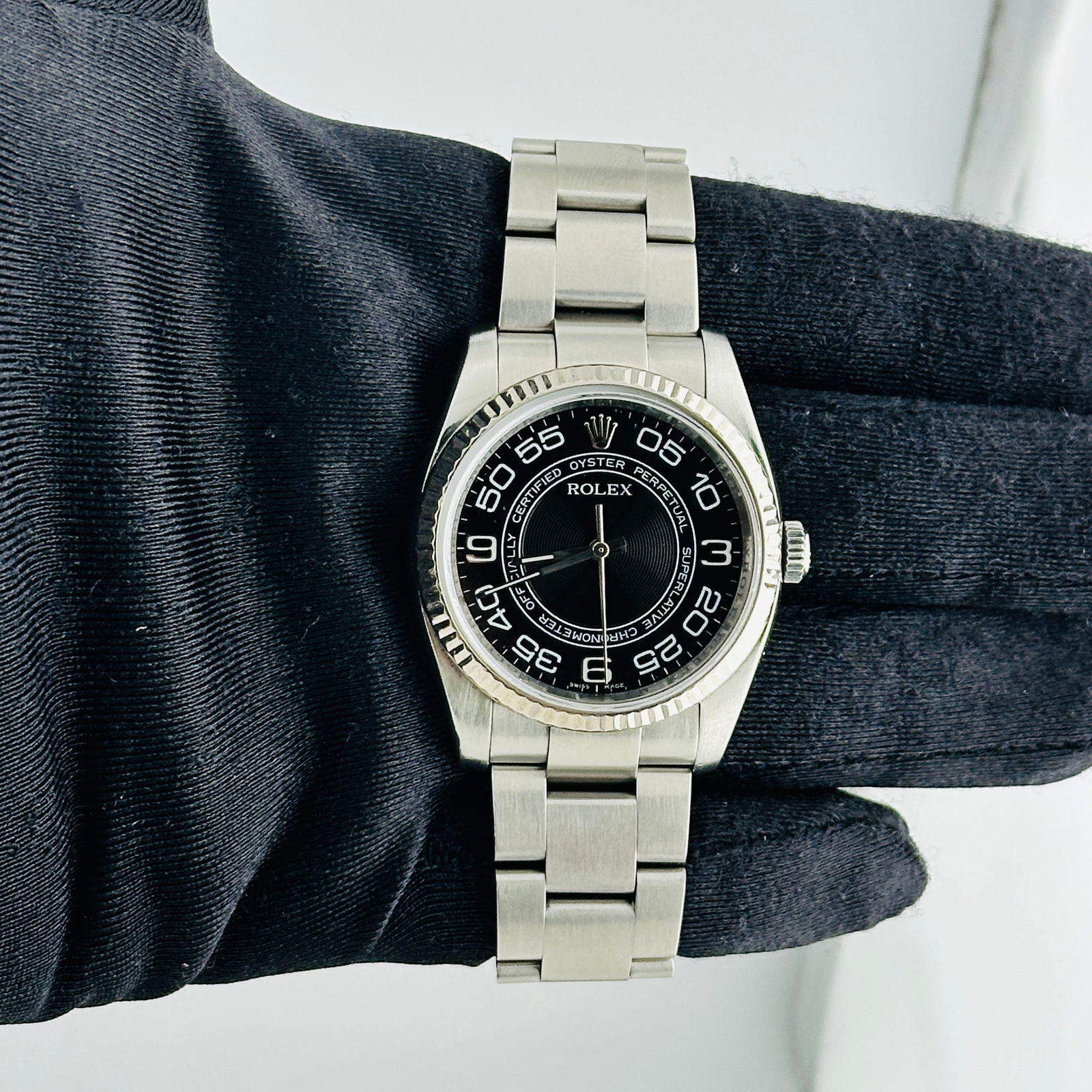 Rolex 116034 Oyster Perpetual Black Arabic Dial Watch With Card 2009: Rolex 116034 Oyster Perpetual Black Arabic Dial Watch With Card 2009 This is a men's Rolex Oyster Perpetual wristwatch, reference 116034, featuring a black Arabic numeral dial and a fluted bezel. The