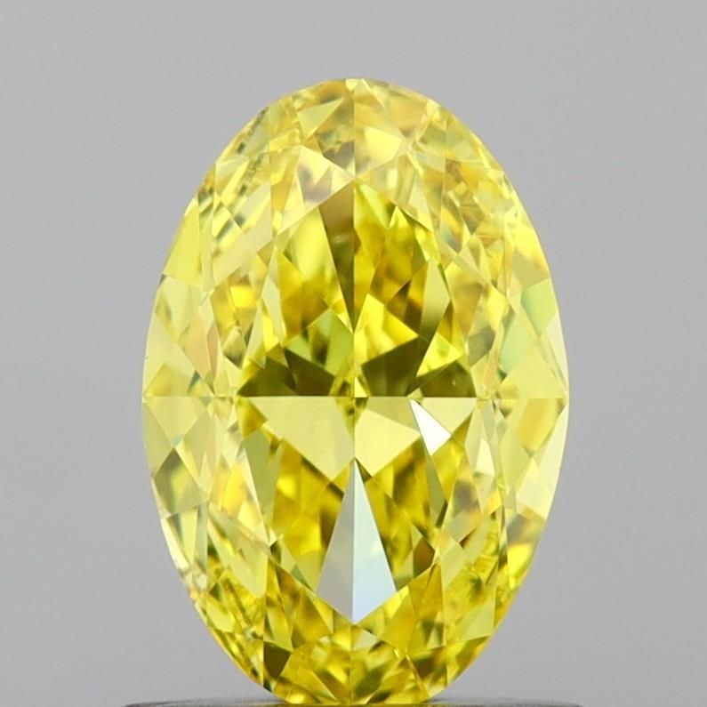 Loose Diamond - OVAL 0.96ct Fancy Vivid Yellow VVS2: Loose Diamond - OVAL 0.96ct Fancy Vivid Yellow VVS2 Source: This is a real non-mined Diamond that has been grown in a lab Shape: OVAL Carats: 0.96 Color: Fancy Vivid Yellow Certification: IGI Video: