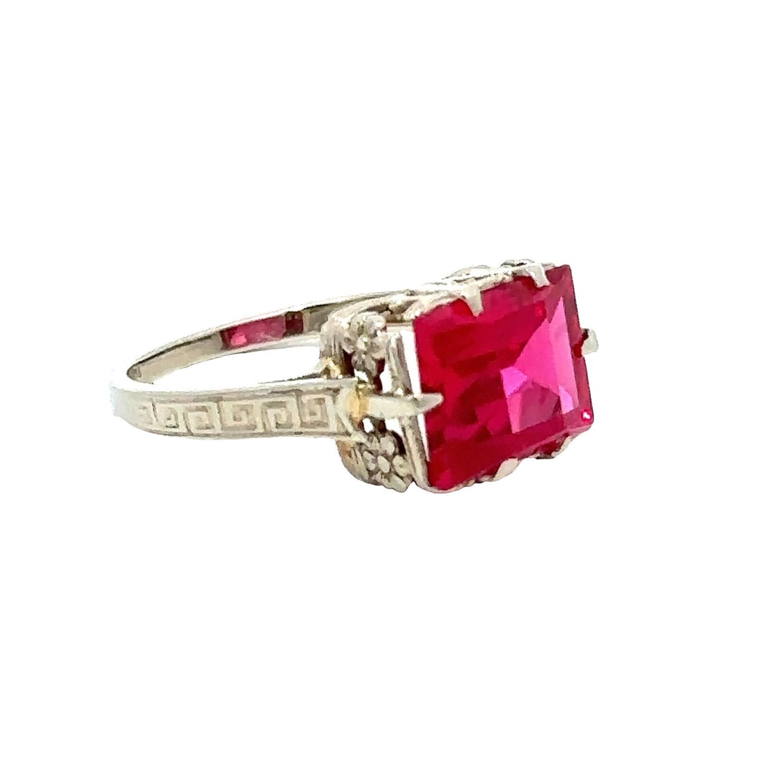 Antique Art Deco 14k White Gold Floral Basket Ring with Red Stone: Antique Art Deco 14k White Gold Floral Basket Ring with Red Stone This exquisite Antique Art Deco ring features a striking red stone set in solid 14k white gold. The design showcases a floral basket m