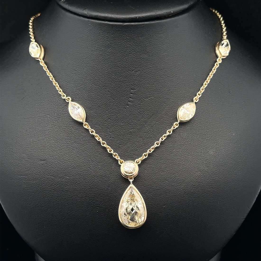 Station Necklace with GIA Certified 3.57ct Pear Diamond and Marquise Accents 18k Gold: Station Necklace with GIA Certified 3.57ct Pear Diamond and Marquise Accents 18k Gold This station necklace features a total of approximately 7.02 carats of natural diamonds set in solid 18k yellow go