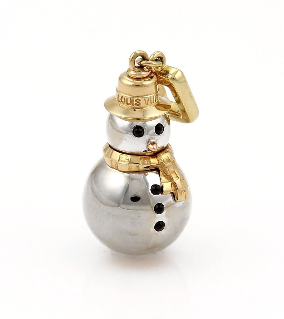 Louis Vuitton Snowman Pendant in 18k Multi-Tone Gold with Onyx Accent: Louis Vuitton Snowman Pendant in 18k Multi-Tone Gold with Onyx Accent This collectible Louis Vuitton Snowman charm pendant is crafted from solid 18k yellow, white, and rose gold, featuring a sculptura