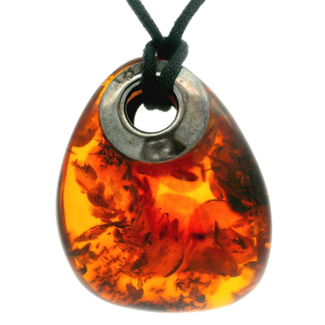 Estate Sterling Silver Amber Drop Pendant on Black Cord Necklace: Estate Sterling Silver Amber Drop Pendant on Black Cord Necklace This stunning Estate Sterling Silver Large Amber Drop Pendant showcases a beautiful natural amber stone in a warm orange hue. The penda